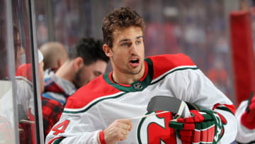 NEWARK, NEW JERSEY - JANUARY 07: Miles Wood #44 of the New Jersey Devils tapes his stick during warm ups before the game against the New York Islanders at Prudential Center on January 07, 2020 in Newark, New Jersey. (Photo by Elsa/Getty Images)