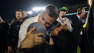 PASADENA, CALIFORNIA - JANUARY 01: Head coach Mario Cristobal of the Oregon Ducks celebrates with his kids after defeating the Wisconsin Badgers in the Rose Bowl game presented by Northwestern Mutual at Rose Bowl on January 01, 2020 in Pasadena, California. (Photo by Michael Heiman/2020 Getty Images)