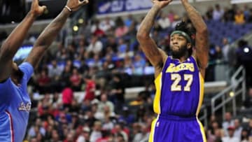 April 6, 2014; Los Angeles, CA, USA; Los Angeles Lakers forward Jordan Hill (27) shoots against the Los Angeles Clippers during the first half at Staples Center. Mandatory Credit: Gary A. Vasquez-USA TODAY Sports