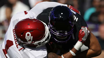 FORT WORTH, TX - OCTOBER 01: Kenny Hill #7 of the TCU Horned Frogs is sacked by Kapri Doucet #1 of the Oklahoma Sooners in the first half at Amon G. Carter Stadium on October 1, 2016 in Fort Worth, Texas. (Photo by Ronald Martinez/Getty Images)