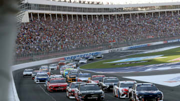 CHARLOTTE, NORTH CAROLINA - MAY 26: William Byron, driver of the #24 Liberty Patriotic Chevrolet, and Aric Almirola, driver of the #10 Smithfield Ford, lead the field into turn one after taking the green flag to start the Monster Energy NASCAR Cup Series Coca-Cola 600 at Charlotte Motor Speedway on May 26, 2019 in Charlotte, North Carolina. (Photo by Streeter Lecka/Getty Images)