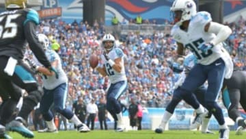 Oct 12, 2014; Nashville, TN, USA; Tennessee Titans quarterback Charlie Whitehurst (12) looks for a receiver in the end zone against the Jacksonville Jaguars during the first half at LP Field. Mandatory Credit: Don McPeak-USA TODAY Sports