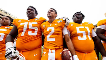 KNOXVILLE, TN - OCTOBER 12: Jerome Carvin #75, Jarrett Guarantano #2 and Elijah Simmons #51 of the Tennessee Volunteers sing to the student section following their win over Mississippi State Bulldogs 20-10at Neyland Stadium on October 12, 2019 in Knoxville, Tennessee. (Photo by Carmen Mandato/Getty Images)