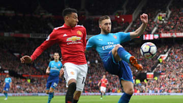 MANCHESTER, ENGLAND - APRIL 29: Calum Chambers of Arsenal is challenged by Jesse Lingard of Manchester United during the Premier League match between Manchester United and Arsenal at Old Trafford on April 29, 2018 in Manchester, England. (Photo by Shaun Botterill/Getty Images)