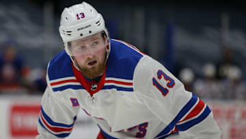 Apr 11, 2021; Uniondale, New York, USA; New York Rangers left wing Alexis Lafreniere (13) awaits a face-off against the New York Islanders during the third period at Nassau Veterans Memorial Coliseum. Mandatory Credit: Brad Penner-USA TODAY Sports