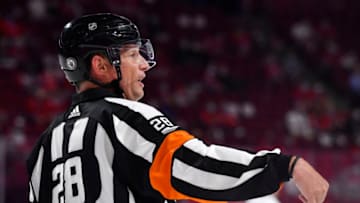 Jun 20, 2021; Montreal, Quebec, CAN; referee Chris Lee (28) during the first period in game four of the 2021 Stanley Cup Semifinals at the Bell Centre. Mandatory Credit: Eric Bolte-USA TODAY Sports