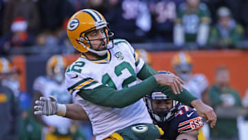 CHICAGO, IL - DECEMBER 16: Aaron Rodgers #12 of the Green Bay Packers is hit after passing by Isaiah Irving #47 of the Chicago Bears closes in at Soldier Field on December 16, 2018 in Chicago, Illinois.The Bears defeated the Packers 24-17. (Photo by Jonathan Daniel/Getty Images)