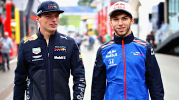 SPIELBERG, AUSTRIA - JUNE 28: Max Verstappen of Netherlands and Red Bull Racing talks with Pierre Gasly of France and Scuderia Toro Rosso in the Paddock during previews ahead of the Formula One Grand Prix of Austria at Red Bull Ring on June 28, 2018 in Spielberg, Austria. (Photo by Mark Thompson/Getty Images)
