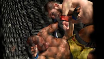 LAS VEGAS, NV - DECEMBER 30: (R-L) Khabib Nurmagomedov of Russia punches Edson Barboza of Brazil in their lightweight bout during the UFC 219 event inside T-Mobile Arena on December 30, 2017 in Las Vegas, Nevada. (Photo by Brandon Magnus/Zuffa LLC/Zuffa LLC via Getty Images)