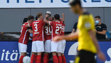 Freiburg players celebrate after scoring (Photo by THOMAS KIENZLE/AFP via Getty Images)