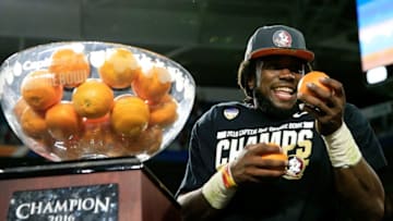 MIAMI GARDENS, FL - DECEMBER 30: MVP Dalvin Cook #4 of the Florida State Seminoles celebrates their 33 to 32 win over the Michigan Wolverines during the Capitol One Orange Bowl at Sun Life Stadium on December 30, 2016 in Miami Gardens, Florida. (Photo by Chris Trotman/Getty Images)