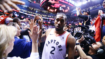 TORONTO, ON - MAY 12: Kawhi Leonard #2 of the Toronto Raptors leaves the court after sinking a buzzer beater to win Game Seven of the second round of the 2019 NBA Playoffs against the Philadelphia 76ers at Scotiabank Arena on May 12, 2019 in Toronto, Canada. NOTE TO USER: User expressly acknowledges and agrees that, by downloading and or using this photograph, User is consenting to the terms and conditions of the Getty Images License Agreement. (Photo by Vaughn Ridley/Getty Images)