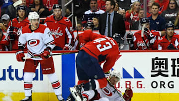 WASHINGTON, DC - APRIL 11: Washington Capitals right wing Tom Wilson (43) hits Carolina Hurricanes center Jordan Staal (11) in the first period on April 11, 2019, at the Capital One Arena in Washington, D.C. in the first round of the Stanley Cup Playoffs. (Photo by Mark Goldman/Icon Sportswire via Getty Images)