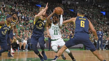 BOSTON, MA - APRIL 17: Kyrie Irving (11) of the Boston Celtics drives through the paint during the game against Domantas Sabonis #11 of the Indiana Pacers in Game Two of Round One of the 2019 NBA Playoffs against the Boston Celtics on April 17, 2019 at the TD Garden in Boston, Massachusetts. NOTE TO USER: User expressly acknowledges and agrees that, by downloading and or using this photograph, User is consenting to the terms and conditions of the Getty Images License Agreement. Mandatory Copyright Notice: Copyright 2019 NBAE (Photo by Brian Babineau/NBAE via Getty Images)