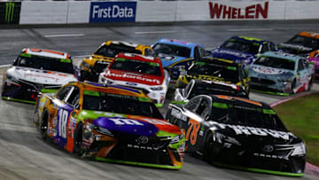 MARTINSVILLE, VA - OCTOBER 29: Kyle Busch, driver of the #18 M&M's Halloween Toyota, leads Martin Truex Jr., driver of the #78 Furniture Row/Denver Mattress Toyota, on the last lap of the Monster Energy NASCAR Cup Series First Data 500 at Martinsville Speedway on October 29, 2017 in Martinsville, Virginia. (Photo by Sarah Crabill/Getty Images)