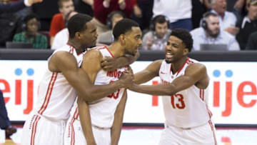 Feb 28, 2016; Columbus, OH, USA; Ohio State Buckeyes center Daniel Giddens (4) and guard JaQuan Lyle (13) congratulate forward Keita Bates-Diop (33) after he blocked an Iowa Hawkeyes shot that would have tied the game at Value City Arena. Ohio State won the game 68-64. Mandatory Credit: Greg Bartram-USA TODAY Sports