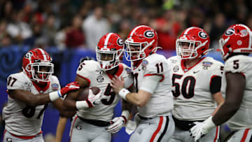 NEW ORLEANS, LOUISIANA - JANUARY 01: Jake Fromm #11 of the Georgia Bulldogs reacts after throwing a touchdown pass to Matt Landers #5 of the Georgia Bulldogs during the game against the Baylor Bears during the Allstate Sugar Bowl at Mercedes Benz Superdome on January 01, 2020 in New Orleans, Louisiana. (Photo by Chris Graythen/Getty Images)