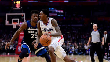LOS ANGELES, CA - DECEMBER 06: Lou Williams #23 of the LA Clippers drives to the basket on Jimmy Butler #23 of the Minnesota Timberwolves during a 113-107 Timberwolves win at Staples Center on December 6, 2017 in Los Angeles, California. (Photo by Harry How/Getty Images)