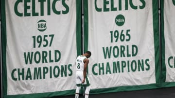 BOSTON, MA - MARCH 04: Kemba Walker #8 of the Boston Celtics stands by the Championship banners after running off the court against the Toronto Raptors at TD Garden on March 4, 2021 in Boston, Massachusetts. NOTE TO USER: User expressly acknowledges and agrees that, by downloading and or using this photograph, User is consenting to the terms and conditions of the Getty Images License Agreement. (Photo by Adam Glanzman/Getty Images)