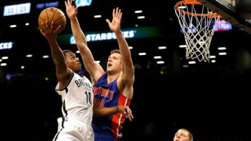 Oct 6, 2016; Brooklyn, NY, USA; Brooklyn Nets guard Yogi Ferrell (10) goes up for a shot while being defended by Detroit Pistons forward Jon Leuer (30) during the second half at Barclays Center. The Nets won 101-94. Mandatory Credit: Andy Marlin-USA TODAY Sports