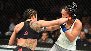 CHICAGO, ILLINOIS - JUNE 09: (L-R) Claudia Gadelha of Brazil punches Carla Esparza in their women's strawweight fight during the UFC 225 event at the United Center on June 9, 2018 in Chicago, Illinois. (Photo by Josh Hedges/Zuffa LLC/Zuffa LLC via Getty Images)