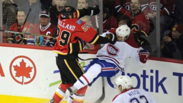 Oct 28, 2014; Calgary, Alberta, CAN; Calgary Flames defenseman Deryk Engelland (29) collides with Montreal Canadiens left wing Travis Moen (32) during the third period at Scotiabank Saddledome. Canadiens won 2-1 in a shootout. Mandatory Credit: Candice Ward-USA TODAY Sports