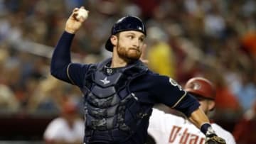 Jul 24, 2015; Phoenix, AZ, USA; Milwaukee Brewers catcher Jonathan Lucroy (20) turns the double play while avoiding Arizona Diamondbacks right fielder Ender Inciarte (5) in the third inning at Chase Field. Mandatory Credit: Rick Scuteri-USA TODAY Sports