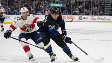 Mar 29, 2023; Toronto, Ontario, CAN; Toronto Maple Leafs forward William Nylander (88) tries to get around Florida Panthers defenseman Gustav Forsling (42) during the third period at Scotiabank Arena. Mandatory Credit: John E. Sokolowski-USA TODAY Sports