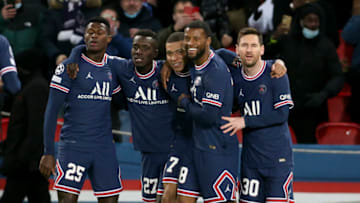 PARIS, FRANCE - DECEMBER 7: Kylian Mbappe of PSG celebrates his goal with Nuno Mendes, Idrissa Gueye Gana, Georginio Wijnaldum, Lionel Messi during the UEFA Champions League group A match between Paris Saint-Germain (PSG) and Club Brugge KV at Parc des Princes stadium on December 7, 2021 in Paris, France. (Photo by John Berry/Getty Images)
