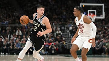 Nov 25, 2022; Milwaukee, Wisconsin, USA; Milwaukee Bucks guard Grayson Allen (12) drives against Cleveland Cavaliers forward Isaac Okoro (35) in the first half at Fiserv Forum. Mandatory Credit: Michael McLoone-USA TODAY Sports