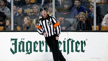 BOSTON, MA - APRIL 25: Referee Kelly Sutherland (11) during Game 7 of the First Round for the 2018 Stanley Cup Playoffs between the Boston Bruins and the Toronto Maple Leafs on April 25, 2018, at TD Garden in Boston, Massachusetts. The Bruins defeated the Maple Leafs 7-4. (Photo by Fred Kfoury III/Icon Sportswire via Getty Images)