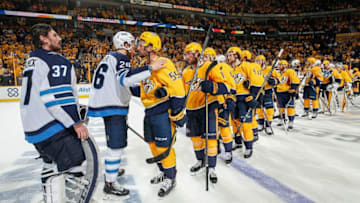 NASHVILLE, TN - MAY 10: Roman Josi #59 of the Nashville Predators shakes hands with Blake Wheeler #26 of the Winnipeg Jets in Game Seven of the Western Conference Second Round during the 2018 NHL Stanley Cup Playoffs at Bridgestone Arena on May 10, 2018 in Nashville, Tennessee. (Photo by John Russell/NHLI via Getty Images)