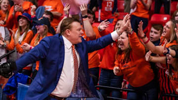 CHAMPAIGN, IL - MARCH 08: Head coach Brad Underwood of the Illinois Fighting Illini celebrates with fans following the game against the Iowa Hawkeyes at State Farm Center on March 8, 2020 in Champaign, Illinois. (Photo by Michael Hickey/Getty Images)