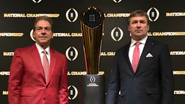 University of Alabama head coach Nick Saban (left) and University of Georgia football head coach Kirby Smart stand (Photo by Mike Zarrilli/Getty Images)