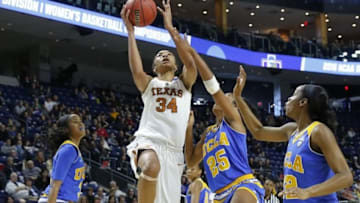Mar 26, 2016; Bridgeport, CT, USA; Texas Longhorns center Imani Boyette (34) shoots against UCLA Bruins forward Monique Billings (25) during the second half in the semifinals of the Bridgeport regional of the women
