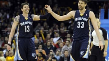 Feb 9, 2014; Cleveland, OH, USA; Memphis Grizzlies small forward Mike Miller (13) and center Marc Gasol (33) celebrate in the fourth quarter against the Cleveland Cavaliers at Quicken Loans Arena. Mandatory Credit: David Richard-USA TODAY Sports