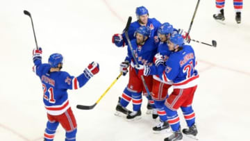 May 8, 2015; New York, NY, USA; New York Rangers left wing Chris Kreider (20) celebrates his goal against the Washington Capitals with New York Rangers center Derek Stepan (21) New York Rangers defenseman Dan Girardi (5) New York Rangers right wing Martin St. Louis (26) and New York Rangers defenseman Ryan McDonagh (27) during the third period of game five of the second round of the 2015 Stanley Cup Playoffs at Madison Square Garden. Mandatory Credit: Brad Penner-USA TODAY Sports
