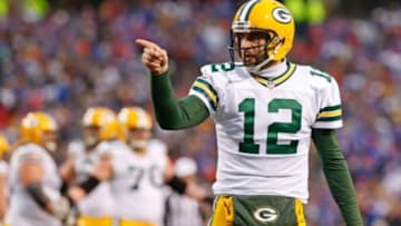 Dec 14, 2014; Orchard Park, NY, USA; Green Bay Packers quarterback Aaron Rodgers (12) gestures during the game against the Buffalo Bills at Ralph Wilson Stadium. The Bills beat the Packers 21-13. Mandatory Credit: Kevin Hoffman-USA TODAY Sports