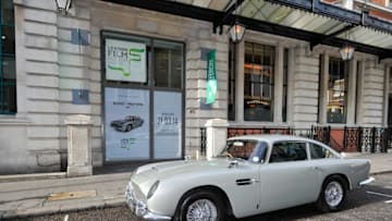 LONDON, ENGLAND - MARCH 02: An Aston Martin DB5 used in the film Goldeneye is loaded in to the London Film Museum ahead of the Bond in Motion exhibition, opening 21st March at the London Film Museum on March 2, 2014 in London, England. (Photo by Gareth Cattermole/Getty Images for London Film Museum)