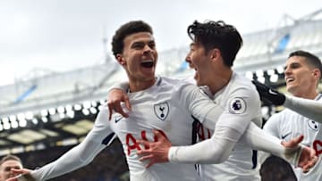 TOPSHOT - Tottenham Hotspur's English midfielder Dele Alli (L) celebrates with Tottenham Hotspur's South Korean striker Son Heung-Min after scoring their second goal during the English Premier League football match between Chelsea and Tottenham Hotspur at Stamford Bridge in London on April 1, 2018. / AFP PHOTO / Glyn KIRK / RESTRICTED TO EDITORIAL USE. No use with unauthorized audio, video, data, fixture lists, club/league logos or 'live' services. Online in-match use limited to 75 images, no video emulation. No use in betting, games or single club/league/player publications. / (Photo credit should read GLYN KIRK/AFP via Getty Images)