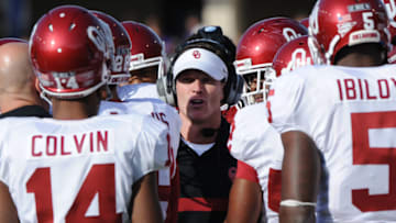 MANHATTAN, KS - OCTOBER 29: Defensive coordinator Brent Venables (C) of the Oklahoma Sooners talks with his defense during a time-out in the first half against the Kansas State Wildcats on October 29, 2011 at Bill Snyder Family Stadium in Manhattan, Kansas. Oklahoma defeated Kansas State 58-17. (Photo by Peter G. Aiken/Getty Images)