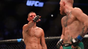 LAS VEGAS, NV - AUGUST 20: (L-R) Nate Diaz taunts Conor McGregor in their welterweight bout during the UFC 202 event at T-Mobile Arena on August 20, 2016 in Las Vegas, Nevada. (Photo by Brandon Magnus/Zuffa LLC/Zuffa LLC via Getty Images)