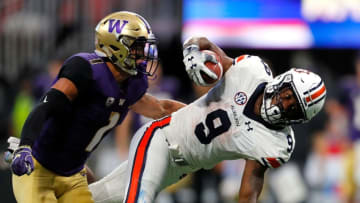 ATLANTA, GA - SEPTEMBER 01: Kam Martin #9 of the Auburn Tigers is tackled by Byron Murphy #1 as he dives over JoJo McIntosh #14 (Photo by Kevin C. Cox/Getty Images)
