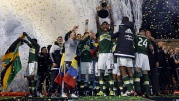 Dec 6, 2015; Columbus, OH, USA; Portland Timbers defender/midfielder Rodney Wallace (22) hoists the MLS Cup championship trophy after defeating the Columbus Crew in the 2015 MLS Cup championship game at MAPFRE Stadium. Mandatory Credit: Geoff Burke-USA TODAY Sports