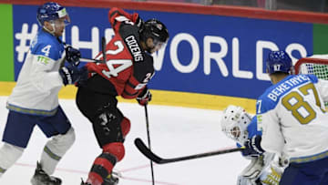 Canada's forward Dylan Cozens (2nd L) scores 1-1 goal as Kazakhstan's defender Yegor Shalapov (L), Kazakhstan's goalkeeper Andrei Shutov (2nd R) and Kazakhstan's defender Adil Beketayev (R) try to stop him during the 2022 IIHF Ice Hockey World Championships preliminary round group A match between Canada and Kazakhstan in Helsinki on May 19, 2022. - Finland OUT (Photo by Jussi Nukari / Lehtikuva / AFP) / Finland OUT (Photo by JUSSI NUKARI/Lehtikuva/AFP via Getty Images)