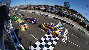 MARTINSVILLE, VA - OCTOBER 28: Kyle Busch, driver of the #18 M&M's Halloween Toyota, leads the field to the green flag to start the Monster Energy NASCAR Cup Series First Data 500 at Martinsville Speedway on October 28, 2018 in Martinsville, Virginia. (Photo by Sarah Crabill/Getty Images)
