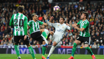 MADRID, SPAIN - MARCH 12: Alvaro Morata of Real Madrid is challenged by Dani Ceballos (L) and Tosca of Real Betis Balompie during the La Liga match between Real Madrid CF and Real Betis Balompie at Estadio Santiago Bernabeu on March 12, 2017 in Madrid, Spain. (Photo by Denis Doyle/Getty Images)