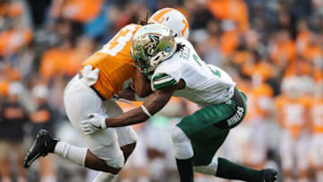 KNOXVILLE, TN - NOVEMBER 3: Running back Jeremy Banks #33 of the Tennessee Volunteers runs the ball and is tackled by Ed Rolle #2 of the Charlotte 49ersduring the game between the Charlotte 49ers and the Tennessee Volunteers at Neyland Stadium on November 3, 2018 in Knoxville, Tennessee. Tennessee won the game 14-3. (Photo by Donald Page/Getty Images)