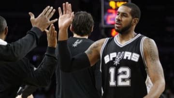 Jan 12, 2016; Auburn Hills, MI, USA; San Antonio Spurs forward LaMarcus Aldridge (12) celebrates with the bench during the third quarter against the Detroit Pistons at The Palace of Auburn Hills. Spurs win 109-99. Mandatory Credit: Raj Mehta-USA TODAY Sports