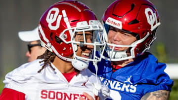 Oklahoma's Trey Morrison (6) and Dillon Gabriel (8) talk during the University of Oklahoma's Spring football practice in Norman, Okla. on Thursday, March 24, 2022.Ou Spring Fb Practice